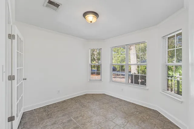a bathroom with a sink vanity mirror and toilet