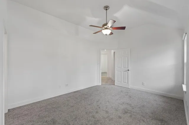 a view of an empty room with empty shelves