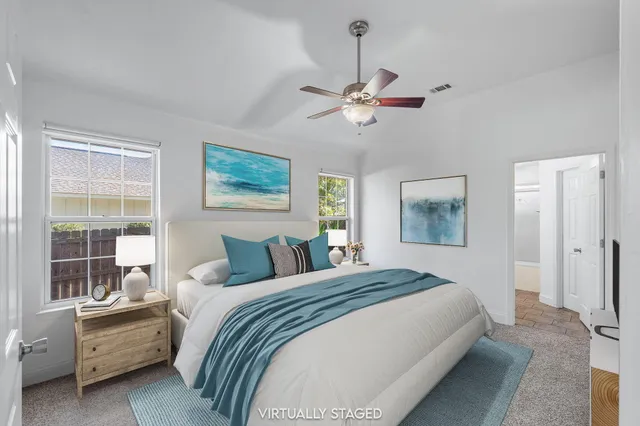 a view of a patio with table and chairs and potted plants