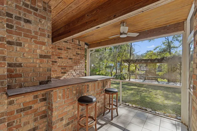 a bathroom with a bathtub shower sink vanity mirror and toilet