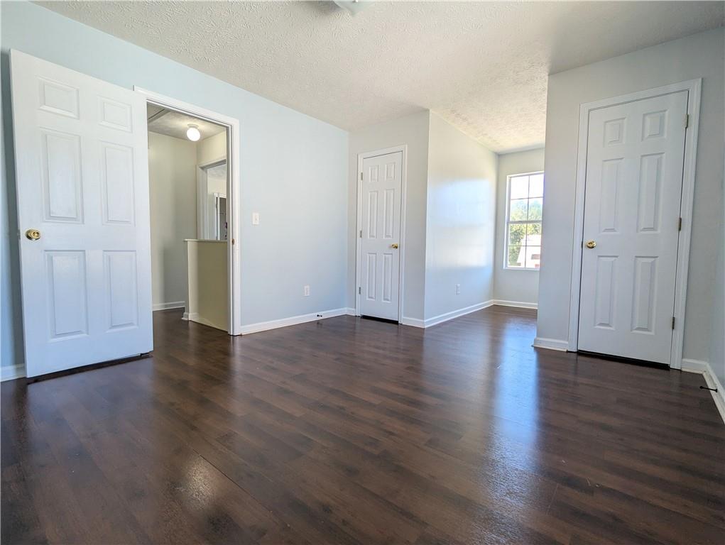 57 Inverness Trace Riverdale, GA 30274 - Photo 15 of 30 an empty room with wooden floor & windows and bathroom