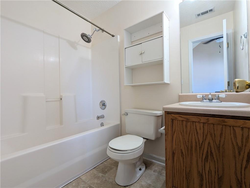 57 Inverness Trace Riverdale, GA 30274 - Photo 20 of 30 a bathroom with a sink a toilet and shower