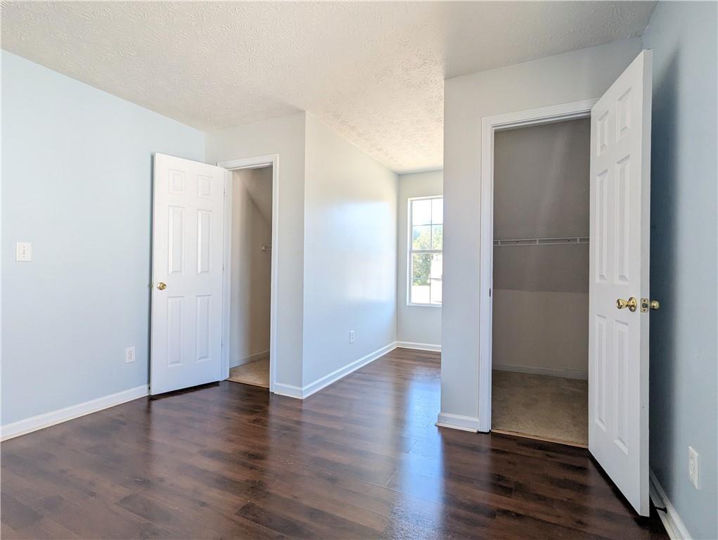 57 Inverness Trace Riverdale, GA 30274 - Photo 25 of 30 an empty room with wooden floor & windows
