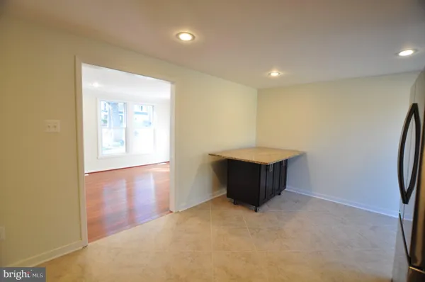 a kitchen with stainless steel appliances a refrigerator and a stove