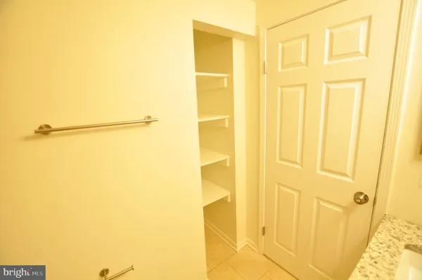 an empty room with windows and entrance