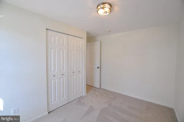 a view of staircase with white walls