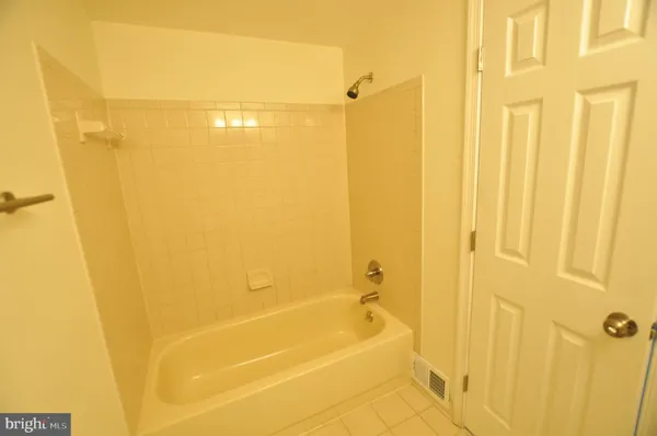 a view of a balcony with wooden floor and fence