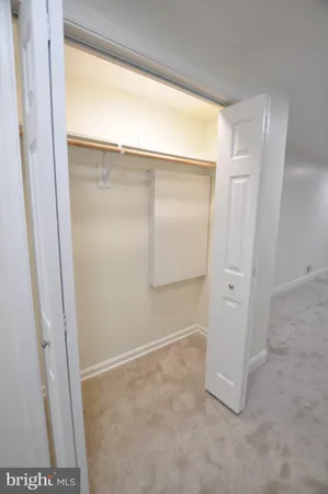 a view of a house with backyard and tree