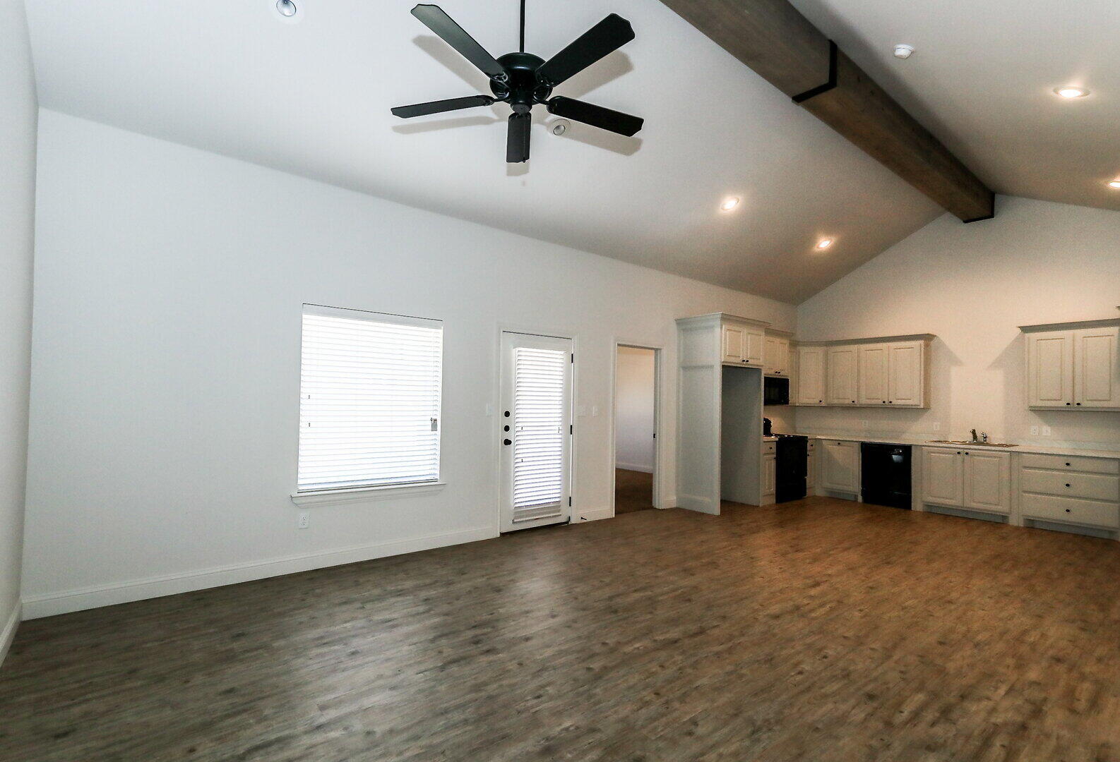 11104 Acme Avenue, Unit A Lubbock, TX 79423 - Photo 4 of 15 a view of a kitchen with a sink and a refrigerator