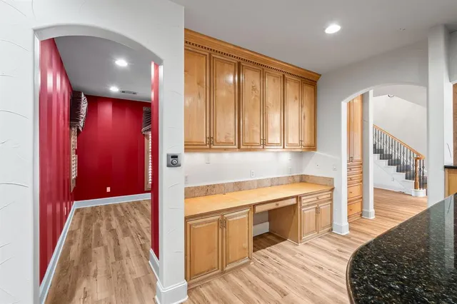 a view of a kitchen with a sink and cabinets