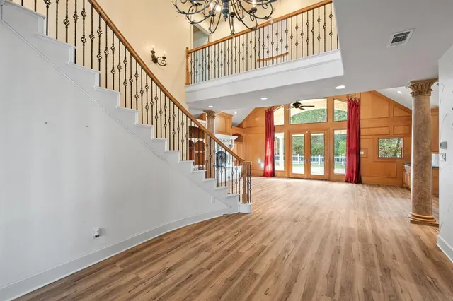 a view of an entryway with wooden floor