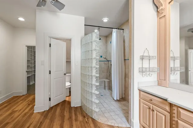 a bathroom with a shower and a sink