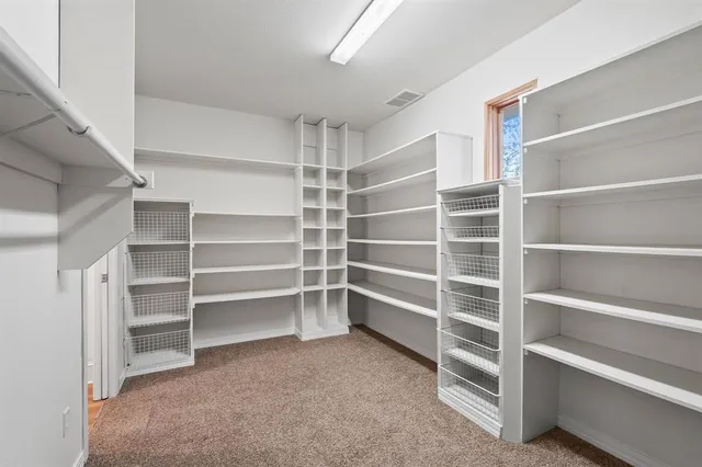 a view of an empty walk in closet