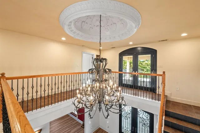 a view of a chandelier in a hall with a chandelier