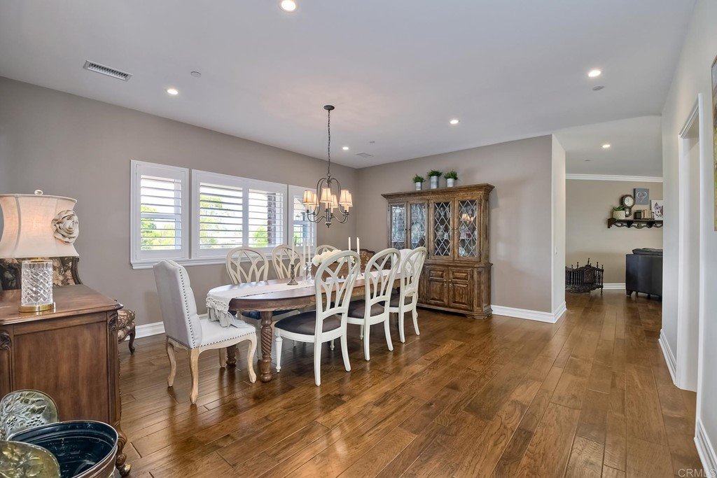 1494 Meredith Road Fallbrook, CA 92028 - Photo 22 of 47 a dining room with furniture and wooden floor