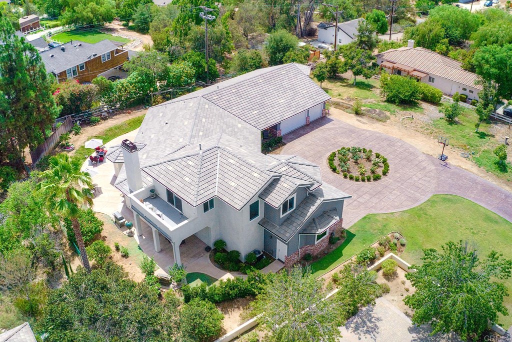 1494 Meredith Road Fallbrook, CA 92028 - Photo 4 of 47 an aerial view of a house with a yard and a large tree