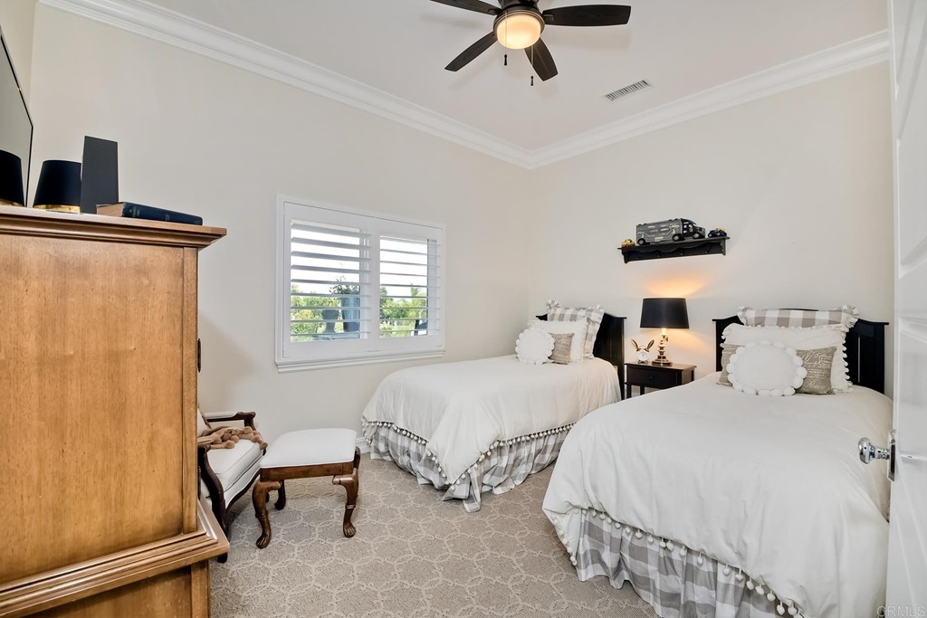 1494 Meredith Road Fallbrook, CA 92028 - Photo 31 of 47 a bedroom with two beds and a window