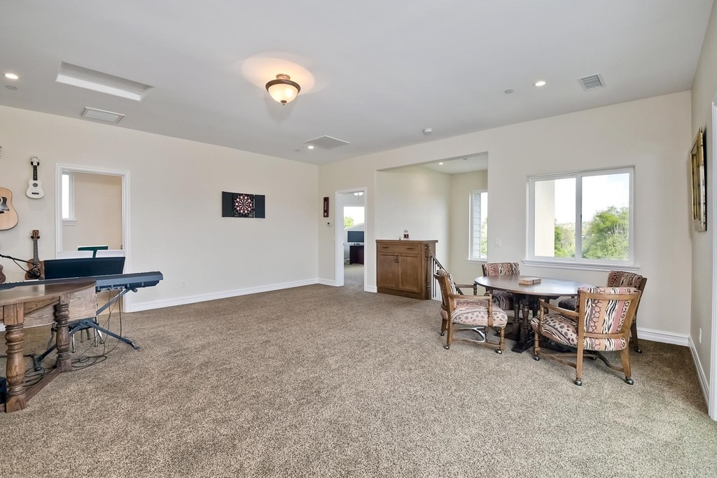 1494 Meredith Road Fallbrook, CA 92028 - Photo 35 of 47 a living room with furniture and a window