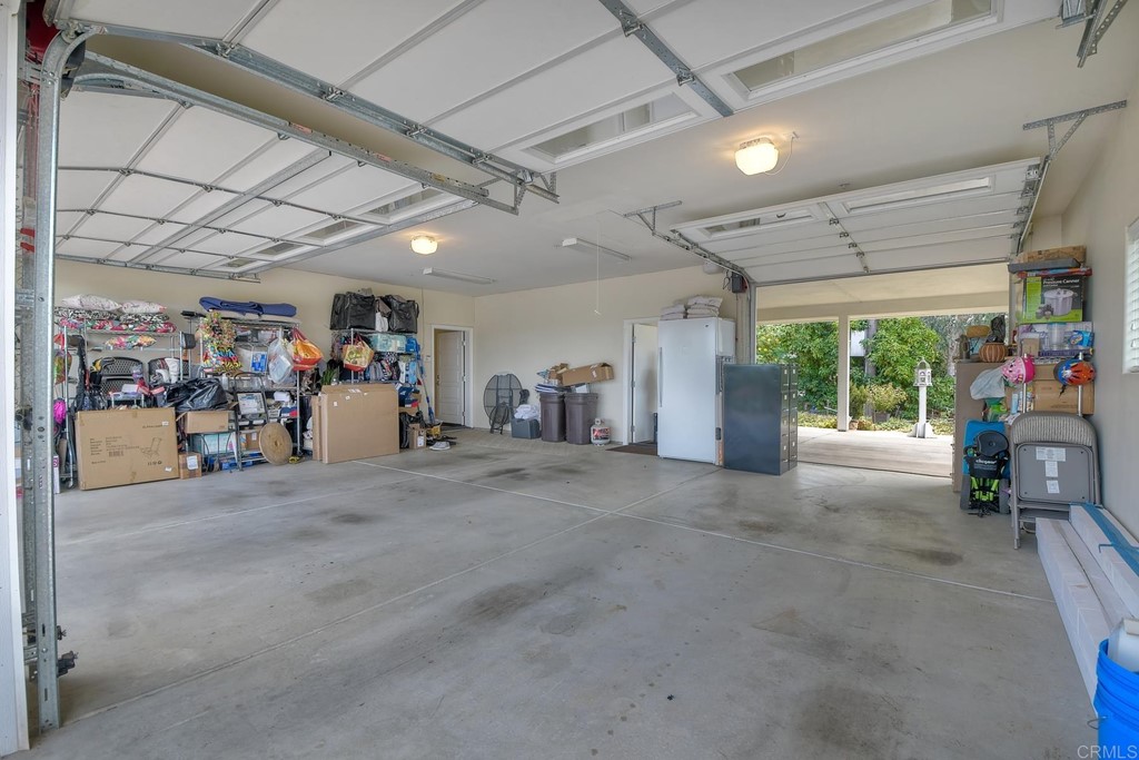 1494 Meredith Road Fallbrook, CA 92028 - Photo 40 of 47 a living room with lots of furniture and a garage