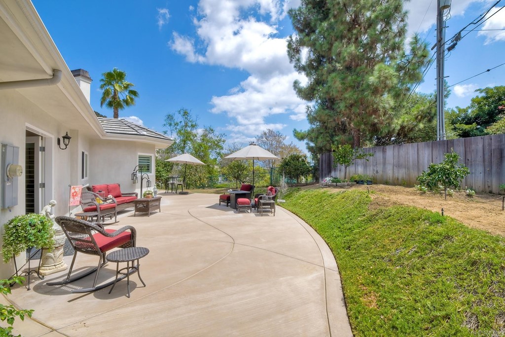 1494 Meredith Road Fallbrook, CA 92028 - Photo 43 of 47 a view of a backyard with a table and chairs and potted plants