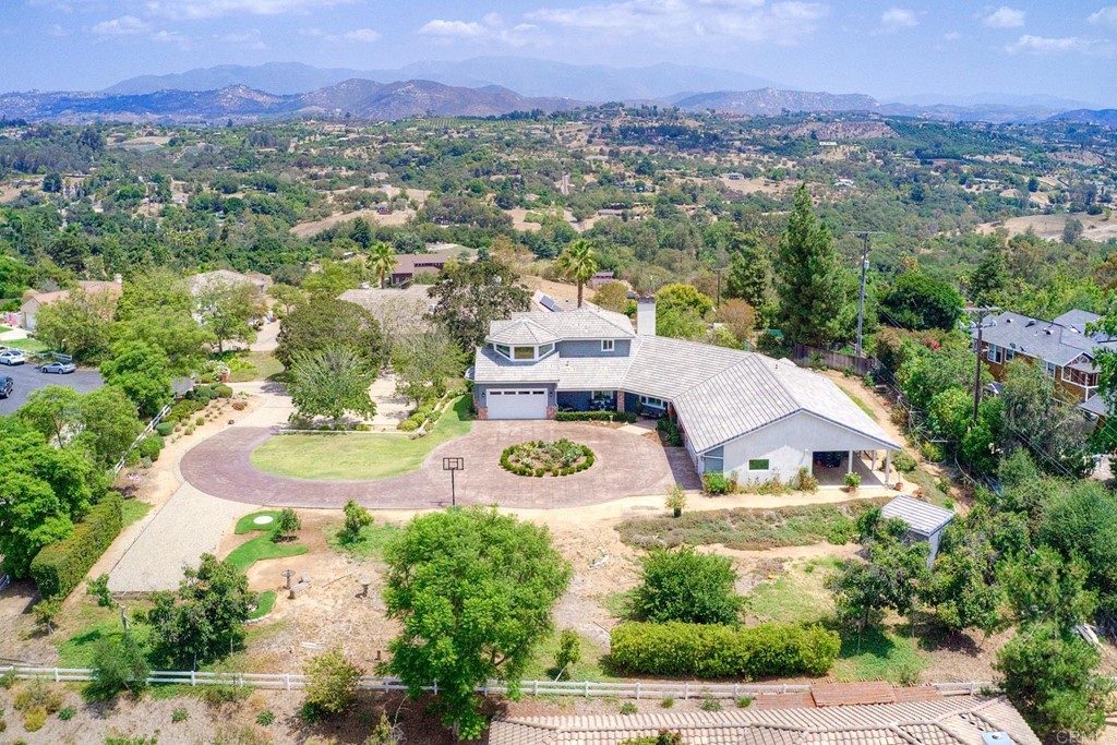 1494 Meredith Road Fallbrook, CA 92028 - Photo 7 of 47 a view of a house with a yard and potted plants