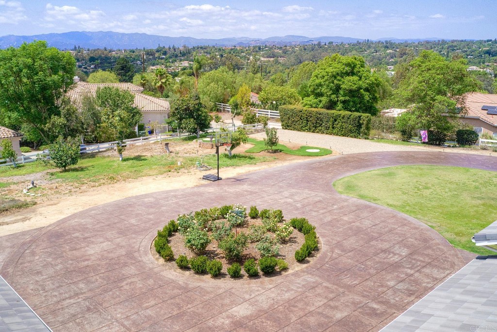 1494 Meredith Road Fallbrook, CA 92028 - Photo 10 of 47 a view of a swimming pool with a yard and a fountain