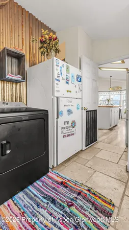 a utility room with cabinets washer and dryer