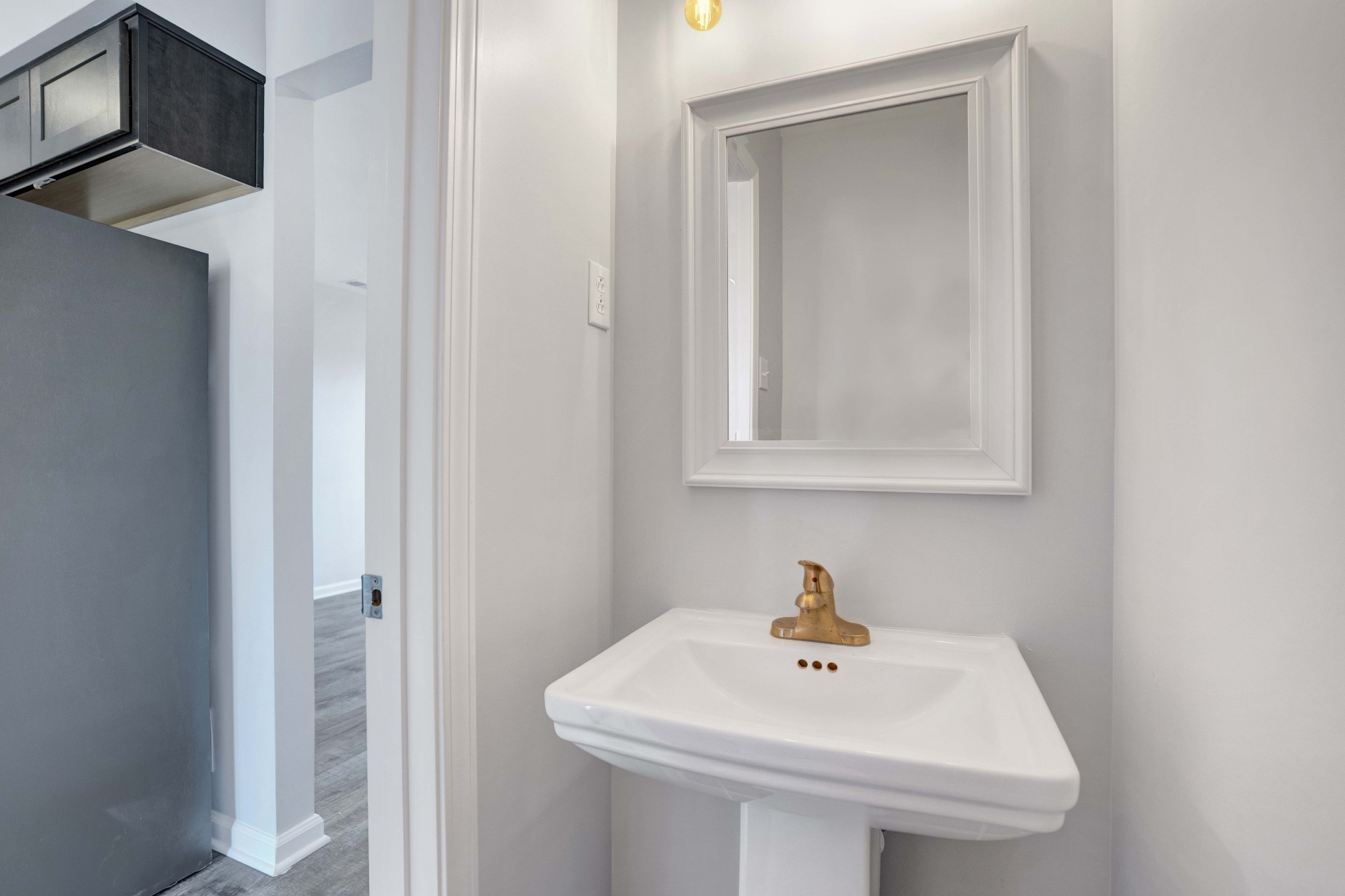 1108 Pembroke Oak Grove Road, Unit 19 Oak Grove, KY 42262 - Photo 13 of 18 a white sink sitting under a bathroom mirror