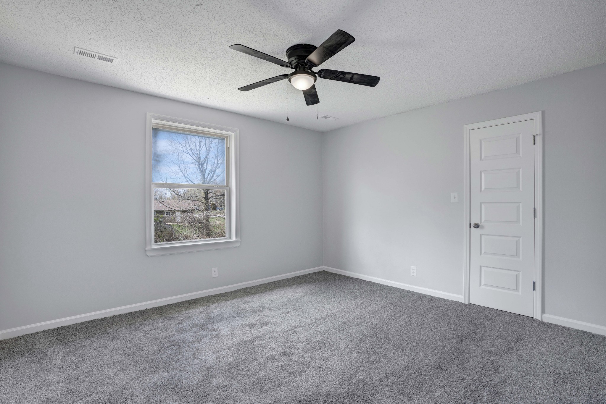 1108 Pembroke Oak Grove Road, Unit 19 Oak Grove, KY 42262 - Photo 15 of 18 an empty room with ceiling fan and windows