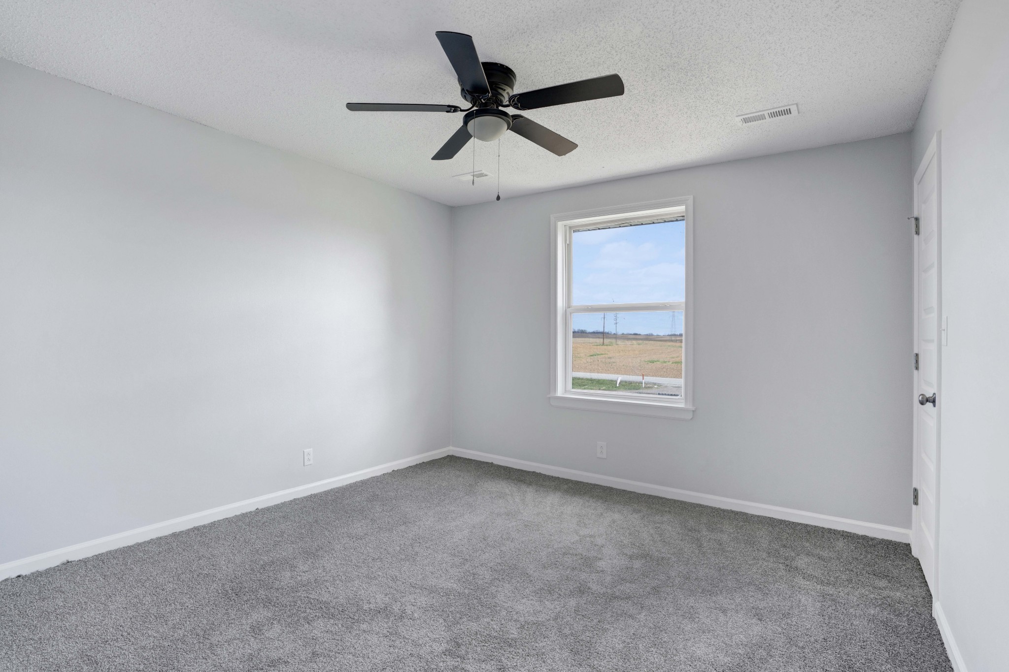 1108 Pembroke Oak Grove Road, Unit 19 Oak Grove, KY 42262 - Photo 17 of 18 an empty room with a window and a ceiling fan