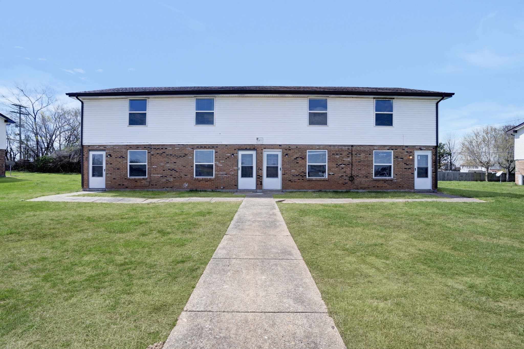 1108 Pembroke Oak Grove Road, Unit 19 Oak Grove, KY 42262 - Photo 2 of 18 a front view of a house with a garden