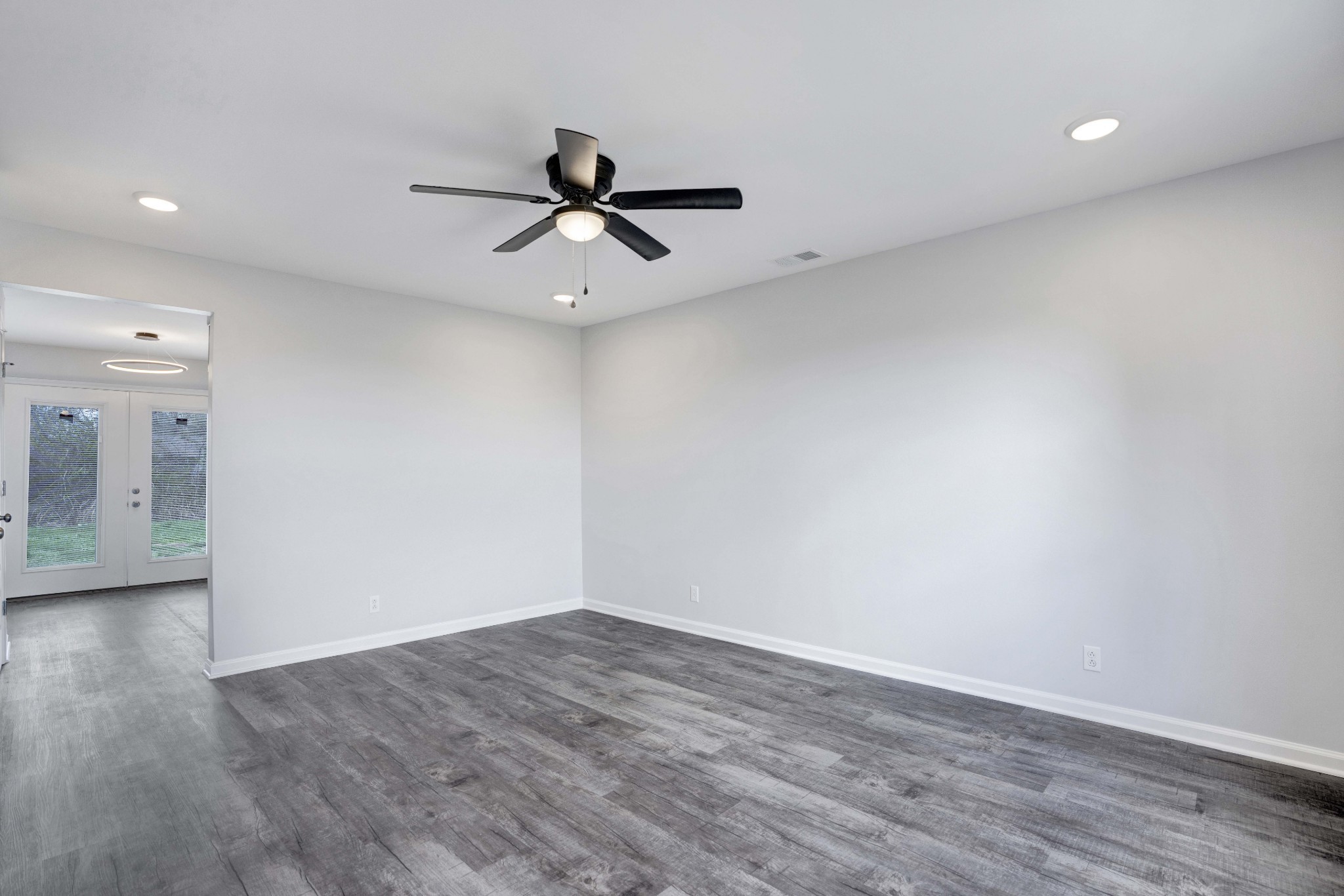 1108 Pembroke Oak Grove Road, Unit 19 Oak Grove, KY 42262 - Photo 4 of 18 wooden floor in an empty room with a window