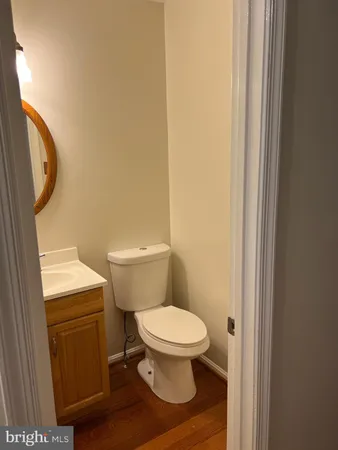 a white toilet sitting next to a shower
