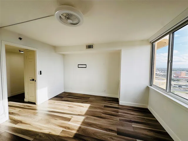 a living room with furniture flat screen tv and fireplace