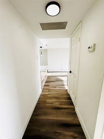 a view of a building with garden and sitting area