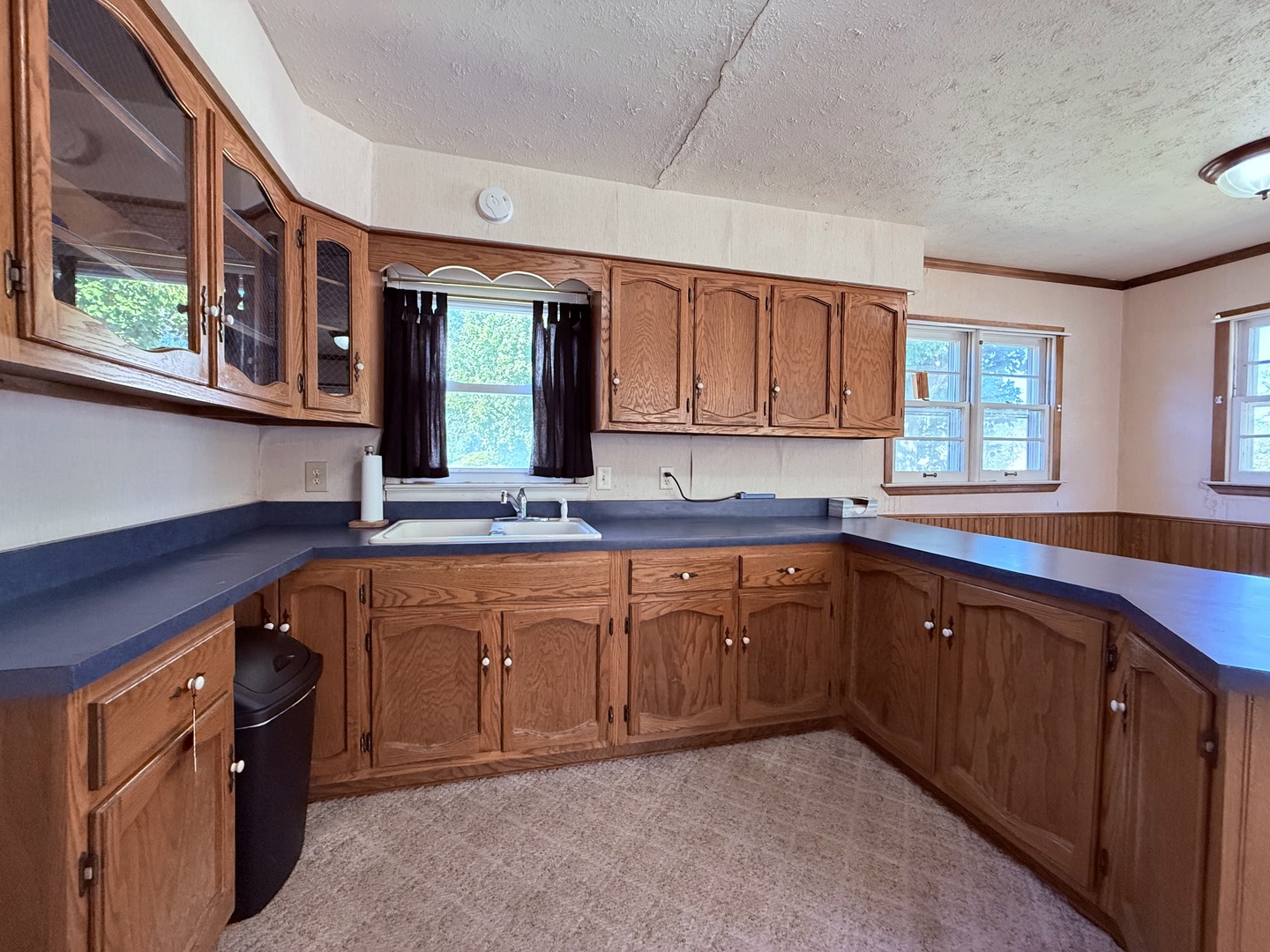 120 West Cherry Street Clinton, IL 61727 - Photo 12 of 15 a kitchen with stainless steel appliances granite countertop a sink dishwasher stove and cabinets