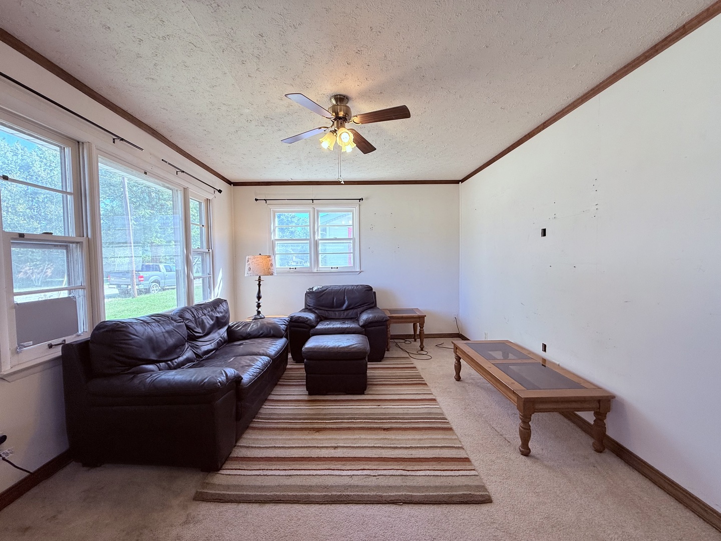 120 West Cherry Street Clinton, IL 61727 - Photo 9 of 15 a living room with furniture and a large window