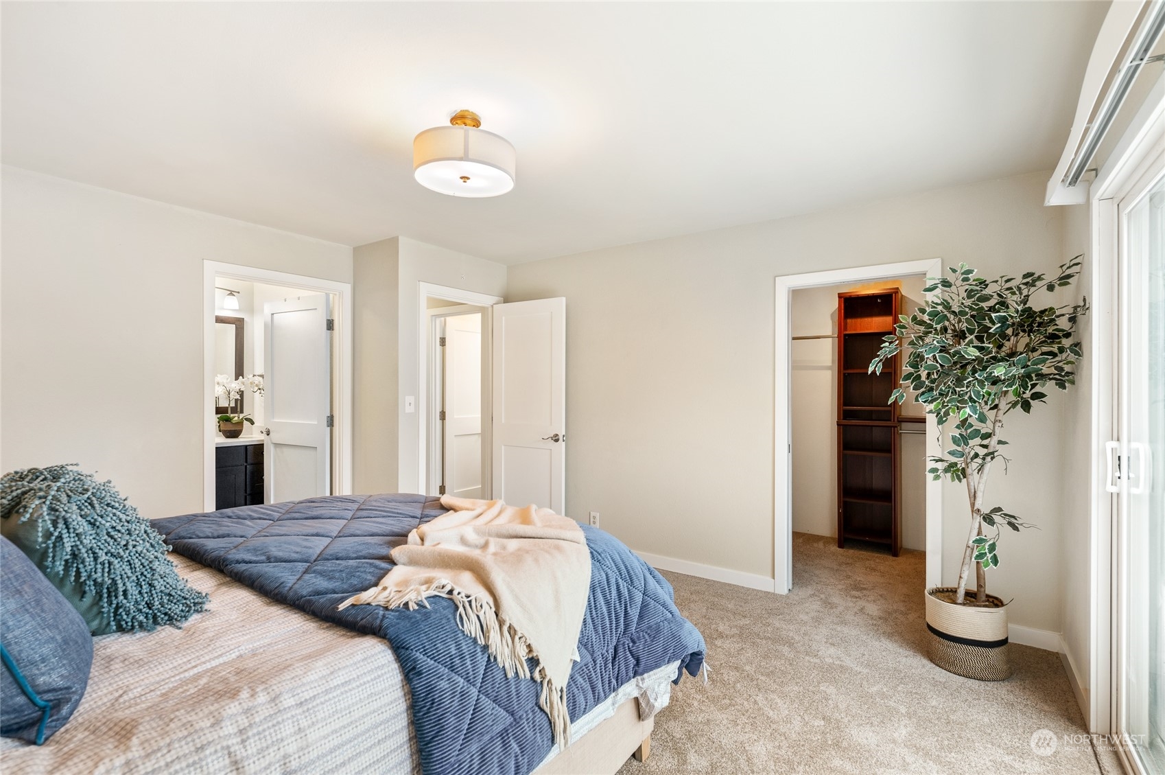 914 North 33rd Street Renton, WA 98056 - Photo 15 of 37 a bedroom with a bed and a chandelier