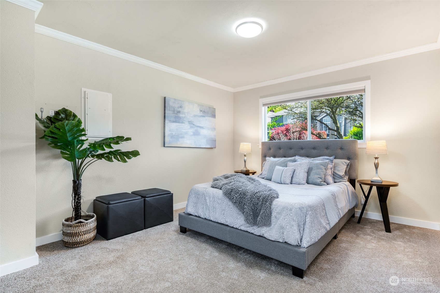 914 North 33rd Street Renton, WA 98056 - Photo 19 of 37 a bedroom with a bed and a potted plant