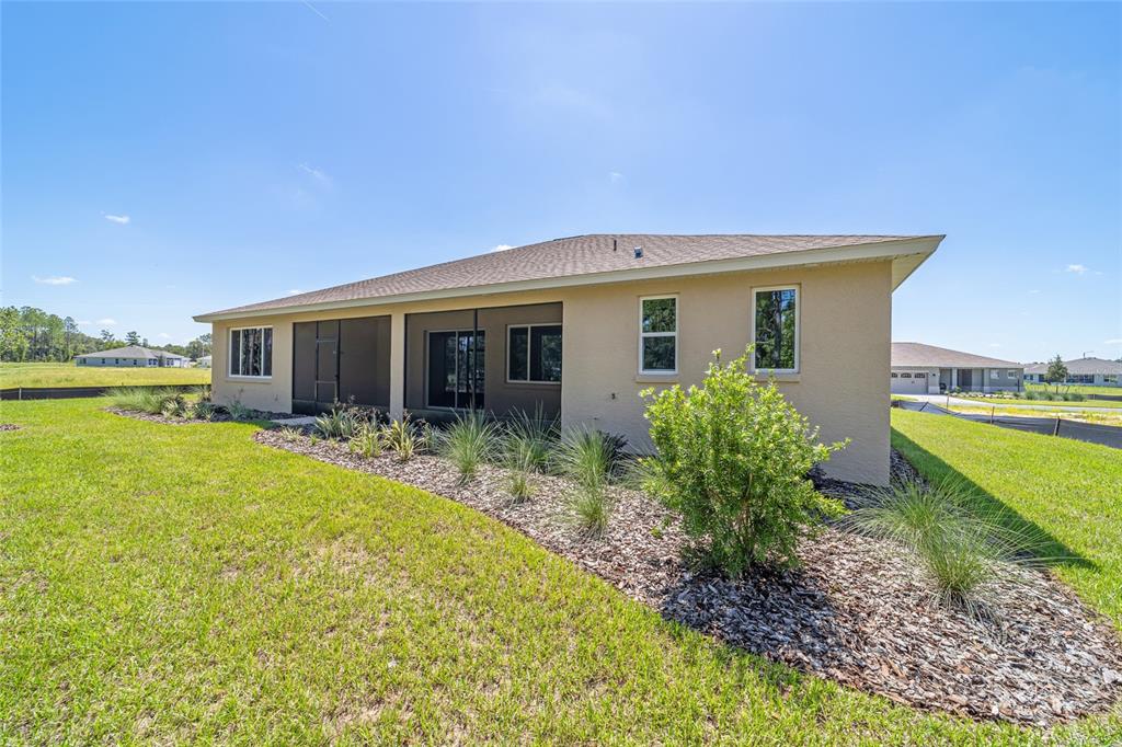 10537 Southwest 96th Lane Road Ocala, FL 34481 - Photo 11 of 75 a view of a house with pool and a garden