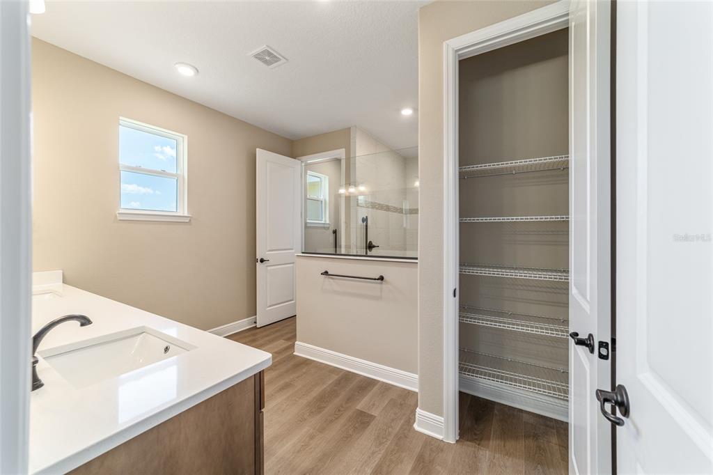 10537 Southwest 96th Lane Road Ocala, FL 34481 - Photo 46 of 75 a bathroom with a sink a toilet and shower