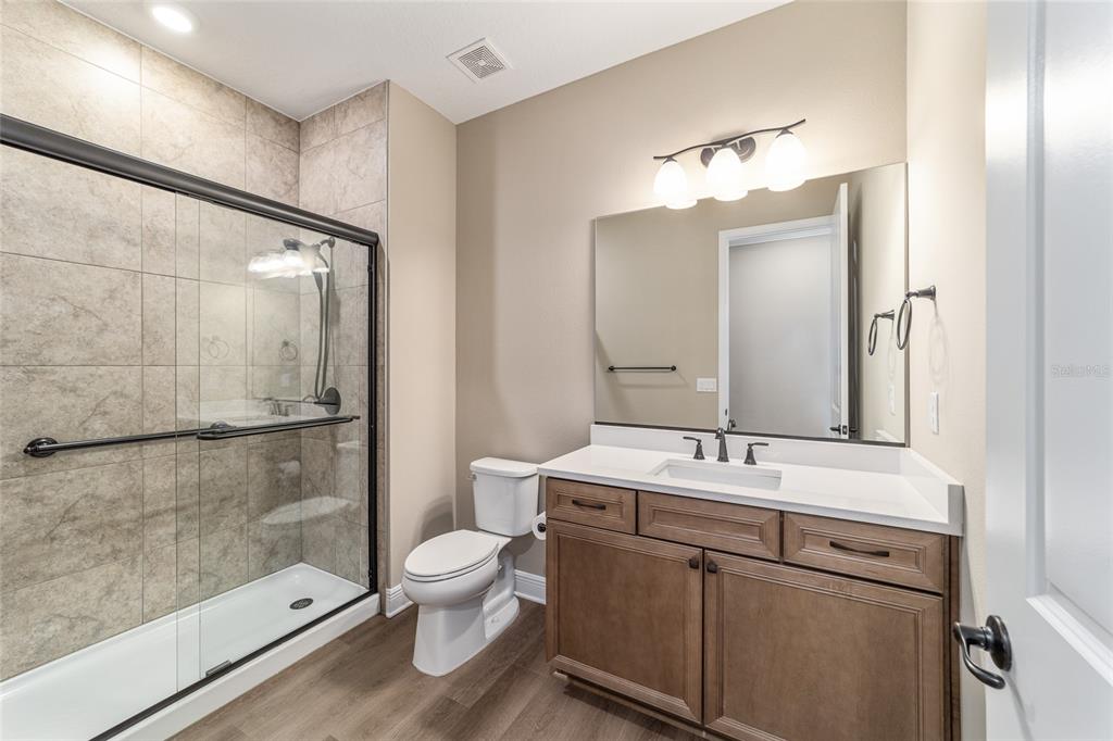 10537 Southwest 96th Lane Road Ocala, FL 34481 - Photo 59 of 75 a bathroom with a sink a toilet and shower