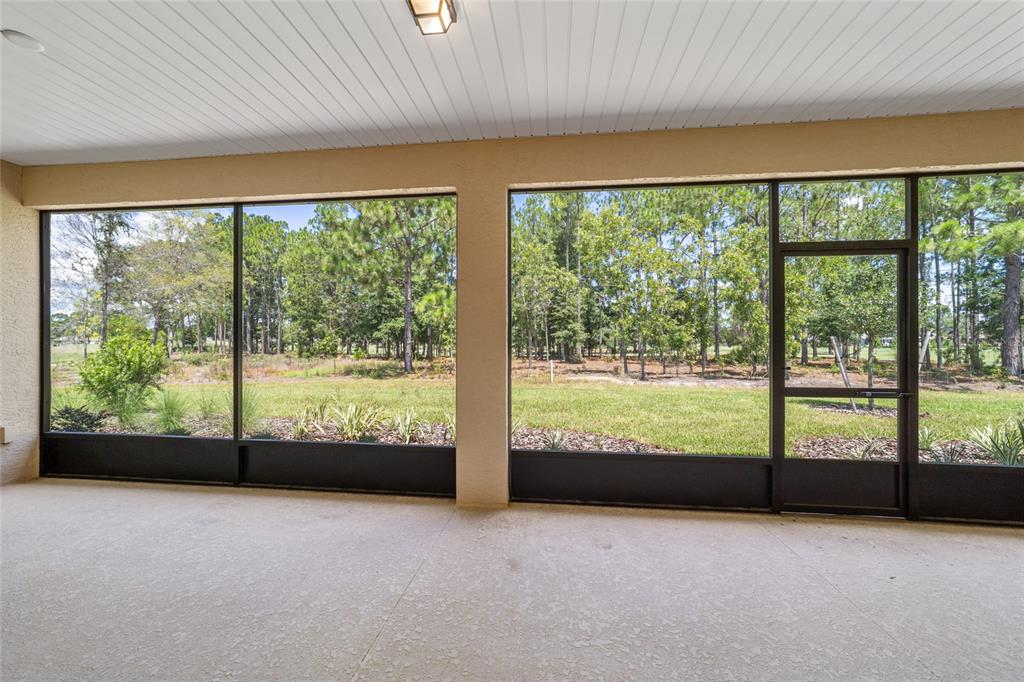 10537 Southwest 96th Lane Road Ocala, FL 34481 - Photo 71 of 75 a view of an empty room with large windows