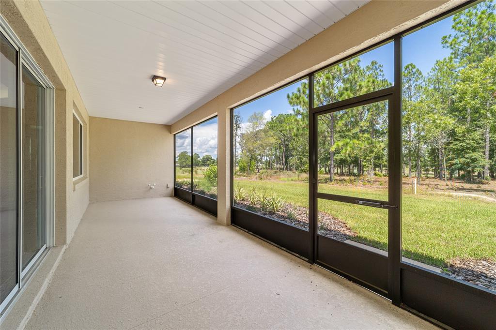 10537 Southwest 96th Lane Road Ocala, FL 34481 - Photo 72 of 75 a view of an empty room with large windows