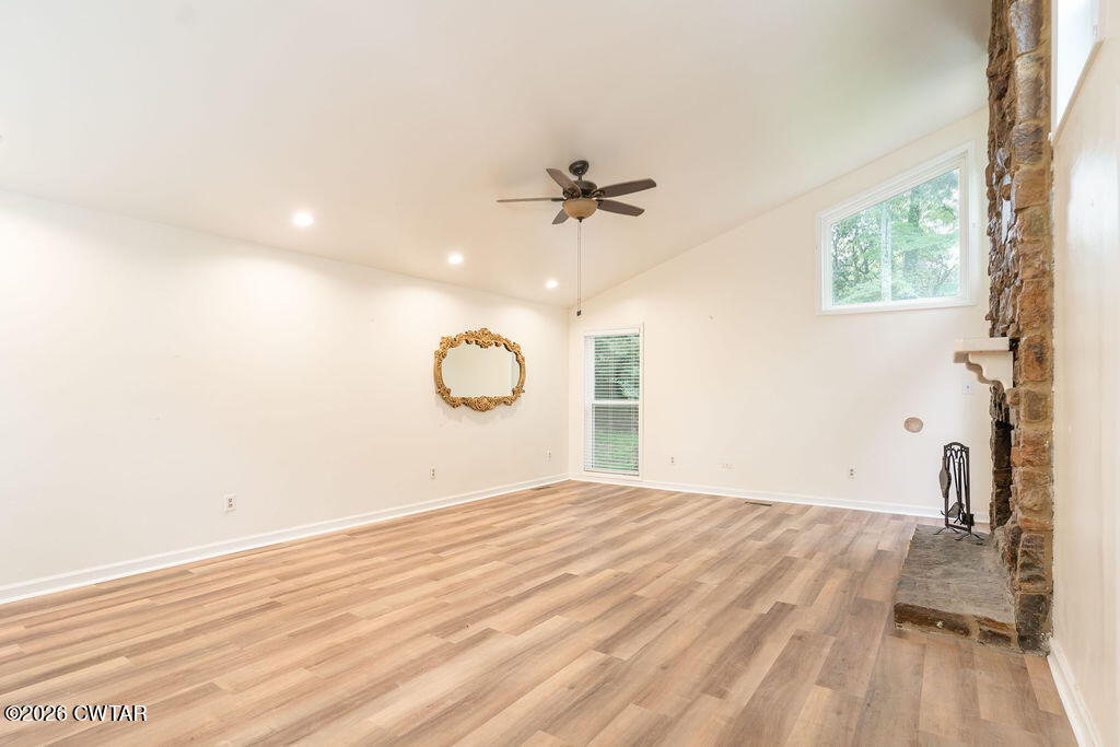 7 Timberlake Drive Jackson, TN 38305 - Photo 9 of 38 a view of a room with wooden floor and ceiling fan