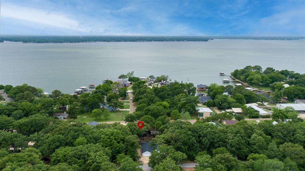 129 King Arthur Road Mabank, TX 75156 - Photo 33 of 33 an aerial view of a houses with a lake view
