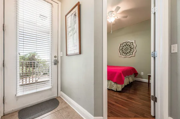 a view of a bedroom with a bed wooden floor and closet
