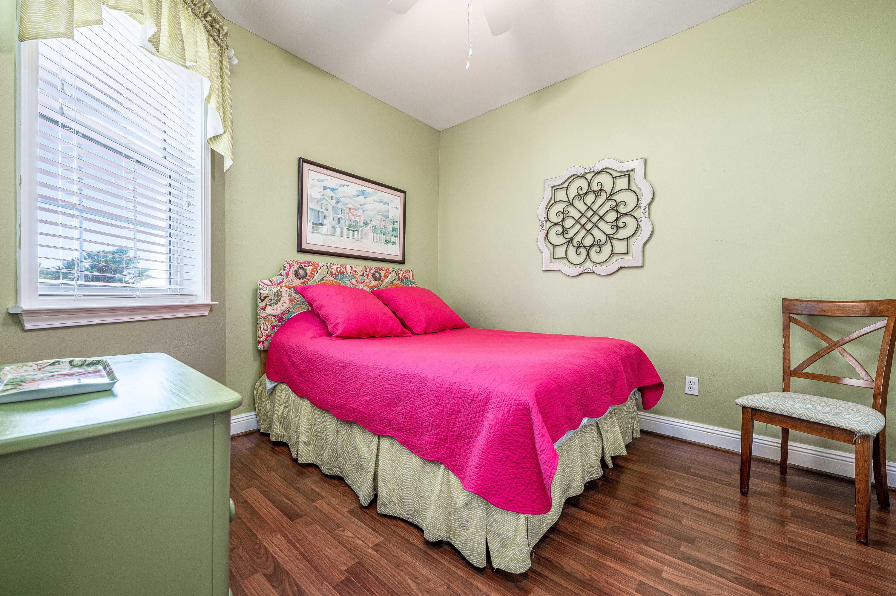 104 Village Boulevard, Unit 621 Santa Rosa Beach, FL 32459 - Photo 12 of 49 a bedroom with a bed and wooden floor