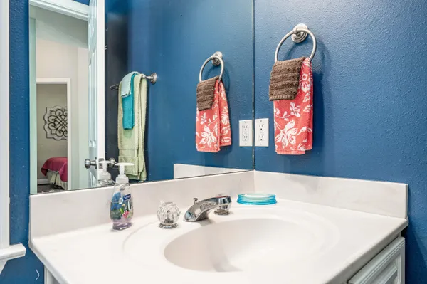 a bathroom with a tub and a sink
