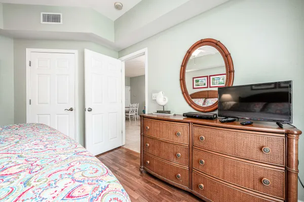 a bedroom with a bed and a dresser